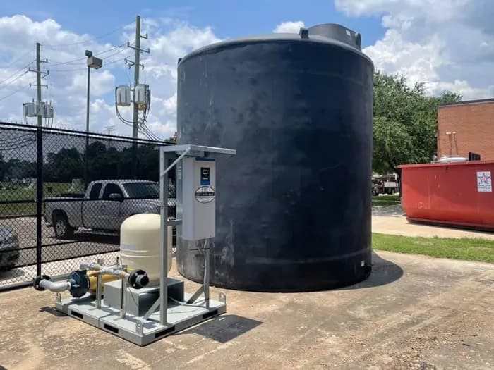Commercial water storage tank and pump skid installed by B-E Waterwell