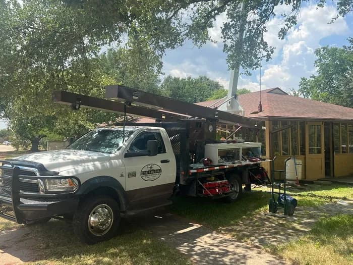 B-E Waterwell crew servicing a legacy windmill well tower